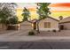Single-story home with a two-car garage and landscaped front yard at 1384 E Morelos St, Chandler, AZ 85225