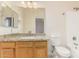 Bathroom with granite countertop, wood cabinets and bathtub at 1384 E Morelos St, Chandler, AZ 85225