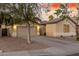 Two-car garage, neutral color exterior, and well-maintained landscaping at 1384 E Morelos St, Chandler, AZ 85225