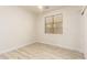 Well-lit bedroom featuring wood-look floors and large window at 1384 E Morelos St, Chandler, AZ 85225