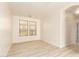 Well-lit spare bedroom with hardwood floors and ample natural light at 1384 E Morelos St, Chandler, AZ 85225