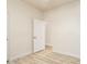 Bedroom with wood-look floors and access to another room at 1384 E Morelos St, Chandler, AZ 85225