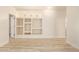 Bright bedroom featuring built-in shelving and wood-look floors at 1384 E Morelos St, Chandler, AZ 85225
