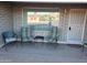 Covered porch with seating at 908 S Ocotillo Dr, Apache Junction, AZ 85120