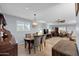 Dining area with a table for four and views to the living room at 10624 W Saratoga Cir, Sun City, AZ 85351