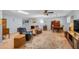 Spacious living room featuring ample seating and a decorative rug at 10624 W Saratoga Cir, Sun City, AZ 85351