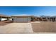 Single-story home with attached garage and desert landscaping at 10624 W Saratoga Cir, Sun City, AZ 85351