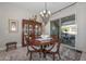 Elegant dining room with a wood table and chandelier at 16822 W Catalina Dr, Goodyear, AZ 85395