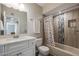 Updated bathroom with new vanity, tile shower, and modern fixtures at 10413 W Oakmont Dr, Sun City, AZ 85351