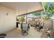 Covered patio with seating area and grill at 16419 W Chuparosa Ln, Surprise, AZ 85387