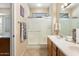 Bathroom with double vanity, shower, and tile floor at 16419 W Chuparosa Ln, Surprise, AZ 85387