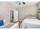 Charming bedroom with a crib and built-in shelves at 7210 S 255Th Ave, Buckeye, AZ 85326