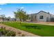 Modern farmhouse with lush lawn and mature tree at 9810 N 57Th St, Paradise Valley, AZ 85253