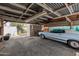 Carport with overhead lighting and ample space for vehicle at 4121 W Medlock Dr, Phoenix, AZ 85019
