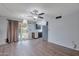 Dining area with wood flooring and kitchen access at 4121 W Medlock Dr, Phoenix, AZ 85019