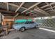 Carport with overhead lighting and a classic car parked inside at 4121 W Medlock Dr, Phoenix, AZ 85019