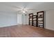 Living room with wood flooring and built-in shelving at 4121 W Medlock Dr, Phoenix, AZ 85019