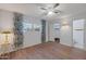 Bedroom with wood-look floors, window with blinds and ceiling fan at 4121 W Medlock Dr, Phoenix, AZ 85019