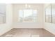 Bright dining room with large window and tile floors at 21033 E Camina Buena Vis, Queen Creek, AZ 85142