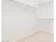 Large walk-in closet with ample shelving and hanging space at 21033 E Camina Buena Vis, Queen Creek, AZ 85142