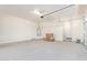 Large garage with high ceilings and ample storage space at 21033 E Camina Buena Vis, Queen Creek, AZ 85142