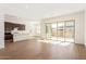 Open living area with kitchen and sliding glass doors at 21033 E Camina Buena Vis, Queen Creek, AZ 85142