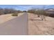 Paved walking path with mature trees and landscaping at 21033 E Camina Buena Vis, Queen Creek, AZ 85142