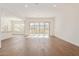 Bright living room with sliding glass doors and kitchen at 21033 E Camina Buena Vis, Queen Creek, AZ 85142