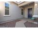 Home exterior showing a front porch and entryway at 21033 E Camina Buena Vis, Queen Creek, AZ 85142