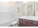 Clean bathroom, featuring a bathtub, toilet and modern vanity at 21033 E Camina Buena Vis, Queen Creek, AZ 85142