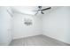 Light-filled bedroom featuring wood-look floors and double closets at 2834 E Nisbet Rd, Phoenix, AZ 85032