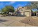 Two-story home with attached two-car garage and landscaped yard at 5542 E Anderson Dr, Scottsdale, AZ 85254