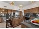 Large kitchen with island, granite countertops, and stainless steel appliances at 5542 E Anderson Dr, Scottsdale, AZ 85254