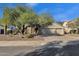 Two-story home with landscaped yard and attached garage at 5542 E Anderson Dr, Scottsdale, AZ 85254