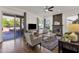 Living room with fireplace and sliding glass doors at 5542 E Anderson Dr, Scottsdale, AZ 85254