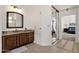 Bathroom with granite vanity, wood cabinets and mirrored medicine cabinet at 5542 E Anderson Dr, Scottsdale, AZ 85254