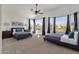 Large main bedroom with two beds and plenty of natural light at 5542 E Anderson Dr, Scottsdale, AZ 85254
