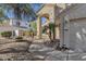 House exterior with landscaped walkway and two-car garage at 5542 E Anderson Dr, Scottsdale, AZ 85254