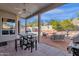 Covered patio with seating area, grill, and pool view at 5542 E Anderson Dr, Scottsdale, AZ 85254