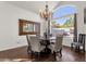 Dining room with chandelier and large window at 5542 E Anderson Dr, Scottsdale, AZ 85254