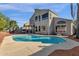 Inviting kidney-shaped pool with brick patio and spacious backyard at 5542 E Anderson Dr, Scottsdale, AZ 85254