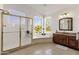 Elegant bathroom with soaking tub, shower, and granite countertops at 5542 E Anderson Dr, Scottsdale, AZ 85254