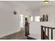 Upstairs hallway with carpet, and doors to bedrooms and bathroom at 5542 E Anderson Dr, Scottsdale, AZ 85254