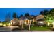 Night view of a beautiful stone house with landscaping at 7745 S Juniper St, Tempe, AZ 85284