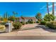 Inviting curb appeal with a long driveway and beautifully landscaped yard at 8575 E Sharon Dr, Scottsdale, AZ 85260