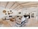 Bright and airy living room with an open floor plan and wood beam ceilings at 8575 E Sharon Dr, Scottsdale, AZ 85260