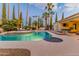 Evening view of the refreshing pool and spa, perfect for relaxation at 8575 E Sharon Dr, Scottsdale, AZ 85260