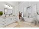 Spa-like bathroom with soaking tub, walk-in shower, and modern vanity at 8575 E Sharon Dr, Scottsdale, AZ 85260