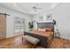 Spacious main bedroom with king bed, and wood flooring at 8575 E Sharon Dr, Scottsdale, AZ 85260