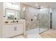 Modern bathroom with a large walk-in shower and white vanity at 8575 E Sharon Dr, Scottsdale, AZ 85260